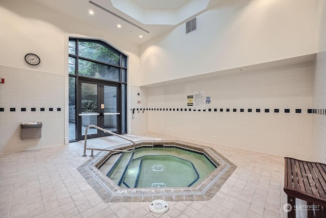 view of pool with an indoor in ground hot tub