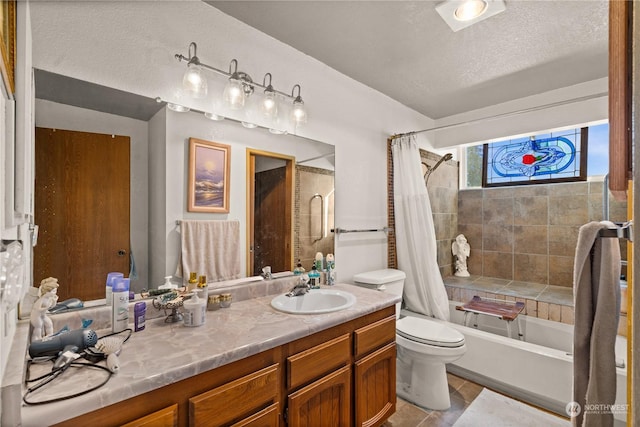 full bathroom featuring toilet, vanity, shower / bathtub combination with curtain, and a textured ceiling