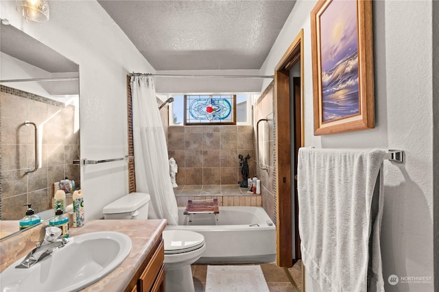 full bathroom with shower / tub combo with curtain, vanity, toilet, and a textured ceiling