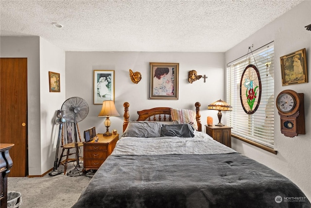 carpeted bedroom featuring a textured ceiling