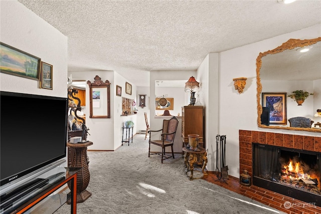 sitting room featuring a fireplace, a textured ceiling, and carpet