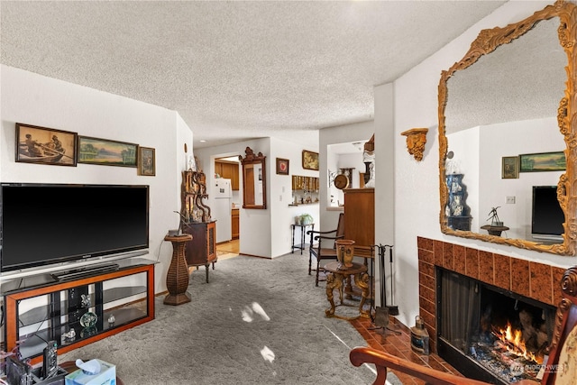 carpeted living room with a fireplace and a textured ceiling