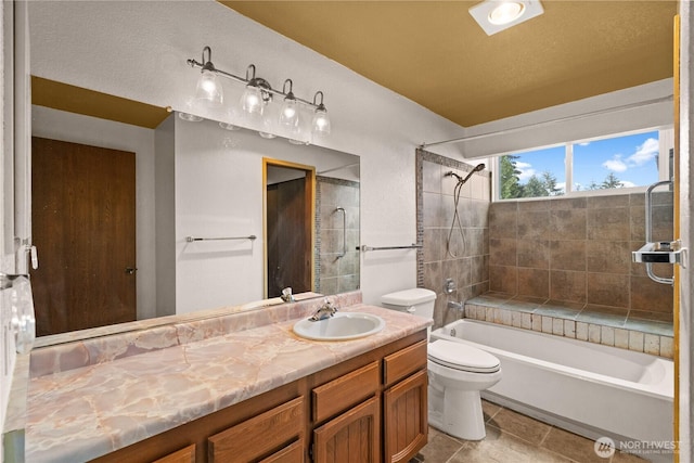 bathroom featuring toilet, bathtub / shower combination, and vanity