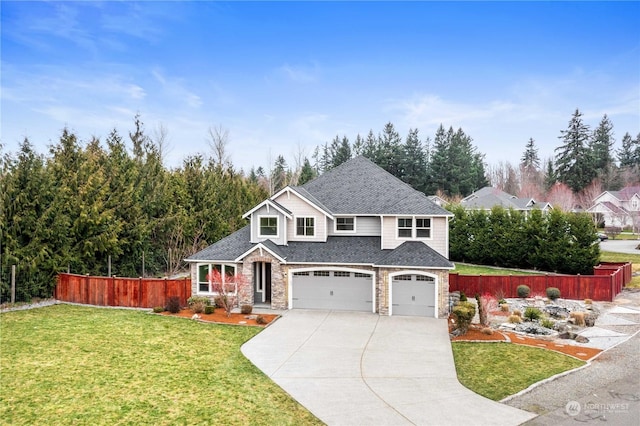 view of front of house with a garage and a front yard