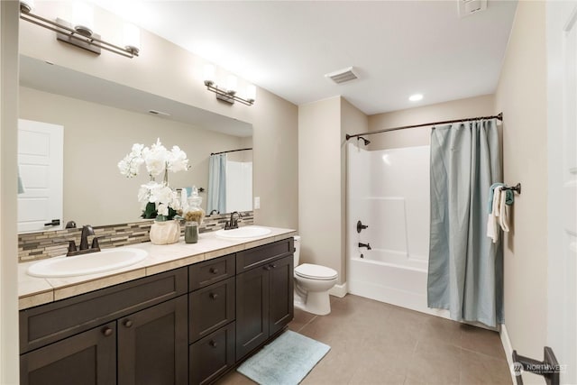 full bathroom featuring shower / tub combo with curtain, toilet, tasteful backsplash, vanity, and tile patterned flooring