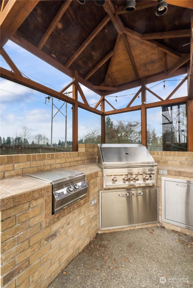 view of patio / terrace featuring area for grilling and an outdoor kitchen