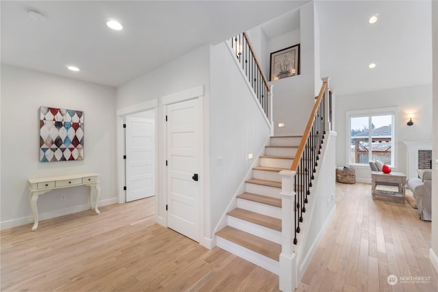 stairs with hardwood / wood-style floors