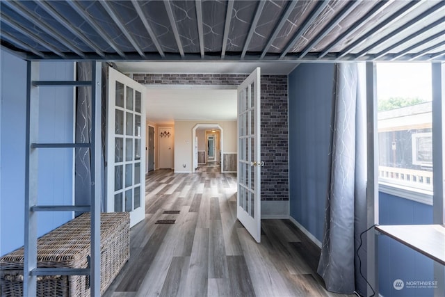 hallway featuring french doors and dark hardwood / wood-style flooring