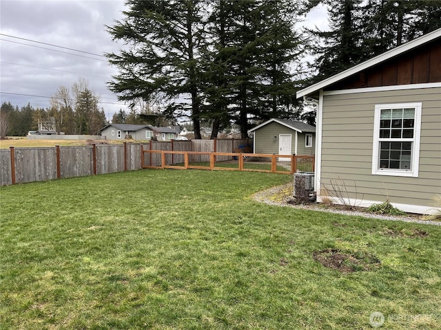 view of yard with a fenced backyard and cooling unit