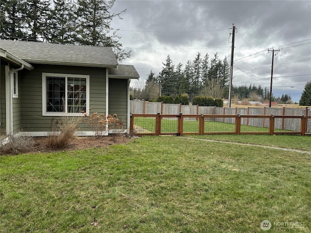 view of yard featuring a gate and fence