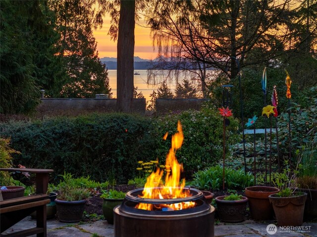 patio terrace at dusk with a fire pit