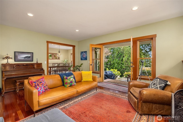 living area with recessed lighting and wood finished floors