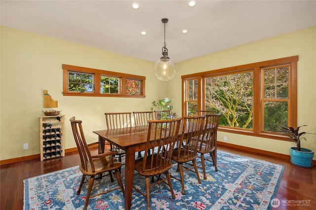dining space featuring recessed lighting, baseboards, a healthy amount of sunlight, and wood finished floors