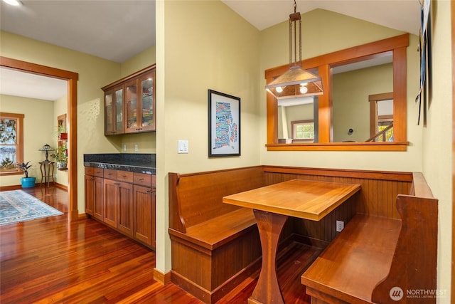 dining room with baseboards and dark wood finished floors