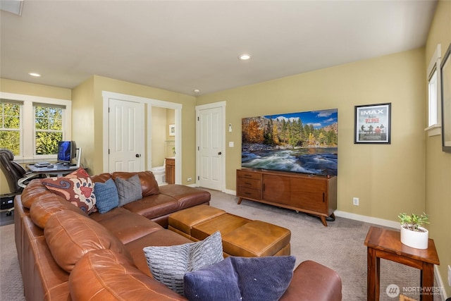 carpeted living area featuring recessed lighting and baseboards