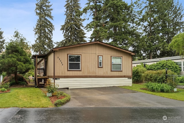 view of home's exterior with a lawn