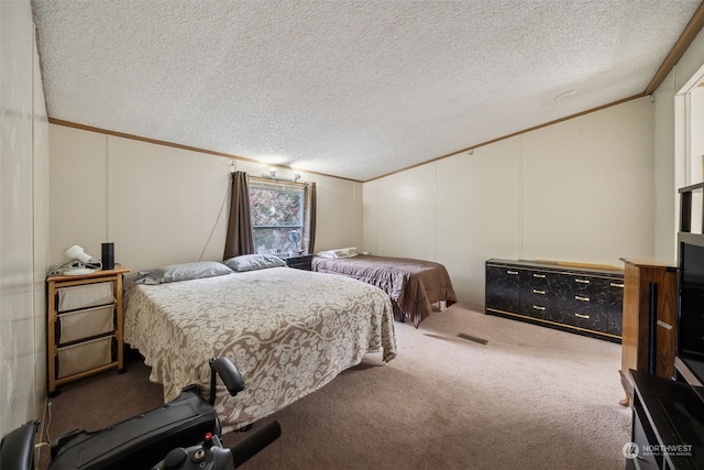 carpeted bedroom with ornamental molding, vaulted ceiling, and a textured ceiling