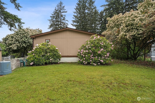 view of home's exterior with a yard