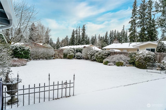 view of yard layered in snow