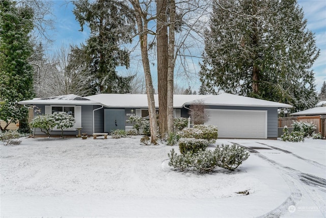 ranch-style home with a garage