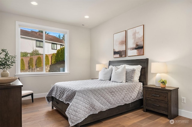 bedroom with light wood-type flooring