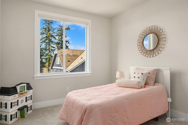 bedroom with light colored carpet