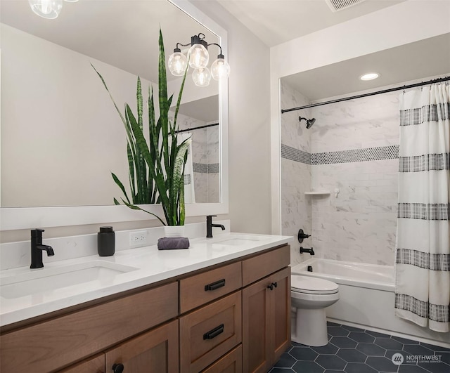 full bathroom with vanity, shower / tub combo with curtain, tile patterned floors, and toilet