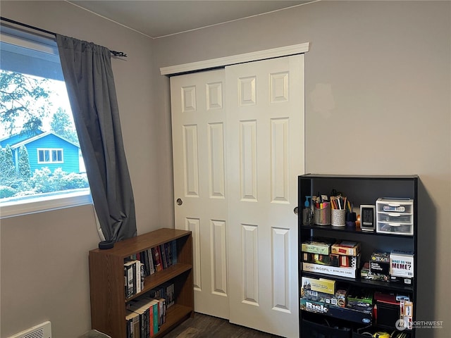 interior space featuring dark hardwood / wood-style floors and a closet