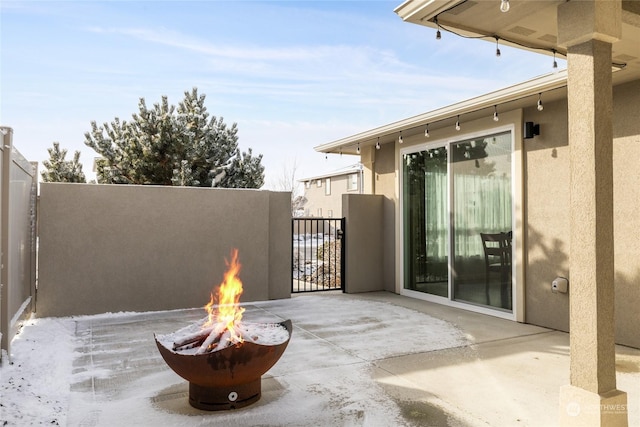 view of patio / terrace with an outdoor fire pit