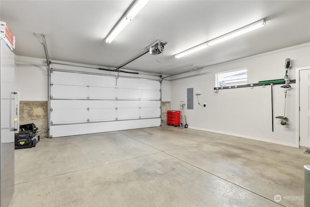 garage with a garage door opener and electric panel