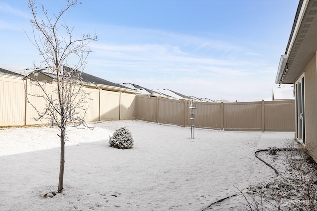 view of yard covered in snow