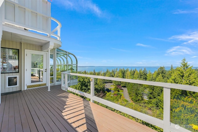 wooden deck with a water view