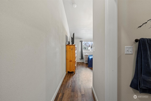 corridor with dark wood-type flooring