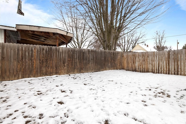 view of yard covered in snow