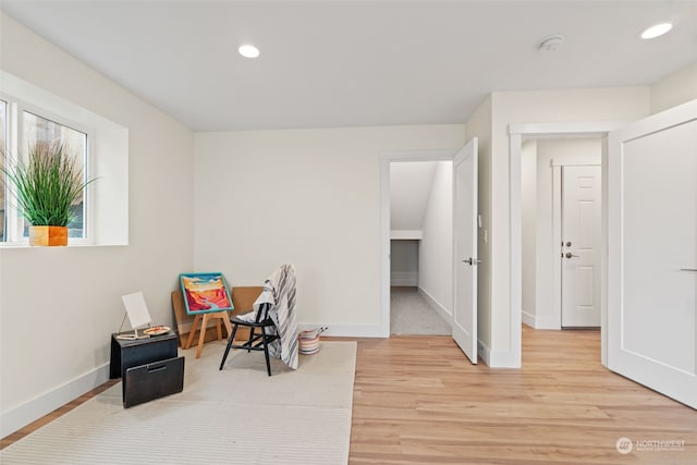 game room with light hardwood / wood-style floors