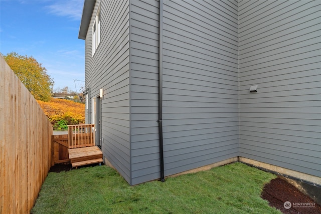 view of side of property with a yard