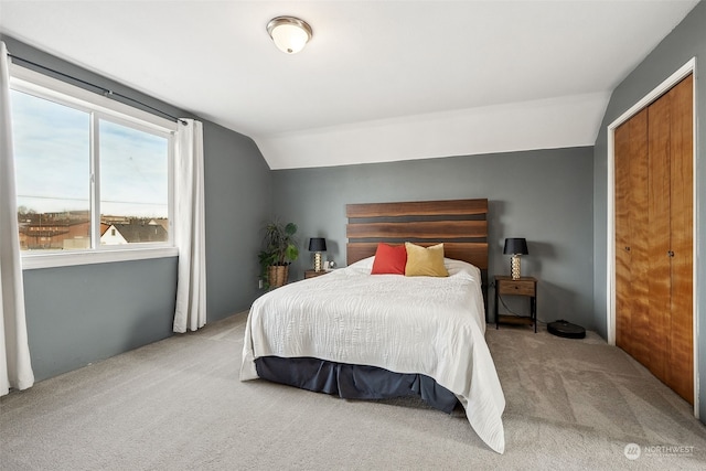 carpeted bedroom featuring vaulted ceiling