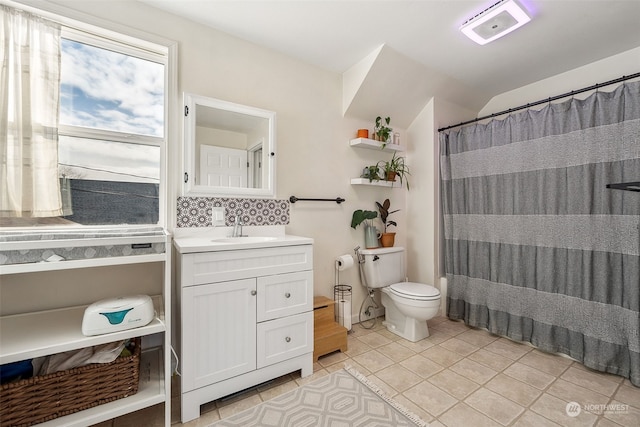 bathroom with tasteful backsplash, vanity, walk in shower, toilet, and tile patterned floors