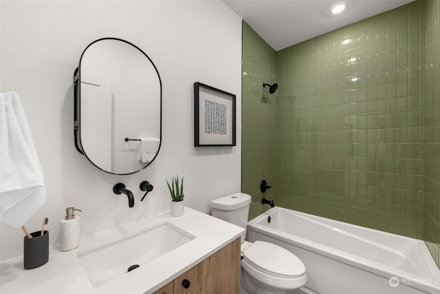 full bathroom featuring vanity, toilet, and tiled shower / bath