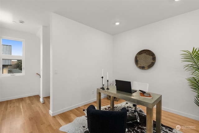 home office featuring light hardwood / wood-style floors