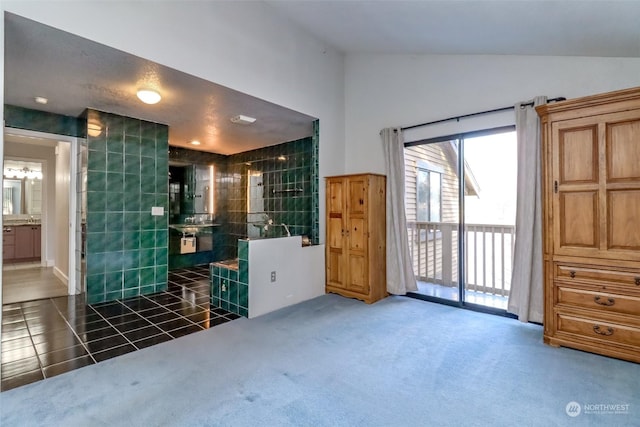 interior space with tile patterned flooring and vaulted ceiling