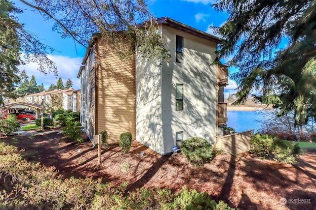 view of home's exterior featuring a water view