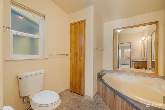 bathroom with tile patterned flooring, vanity, and toilet