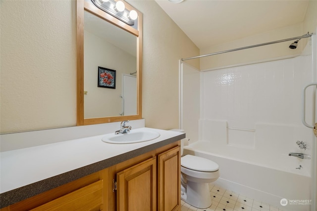 full bathroom with toilet, vanity, and shower / washtub combination