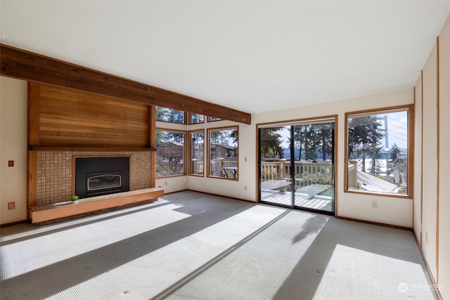 unfurnished living room featuring a fireplace and carpet floors