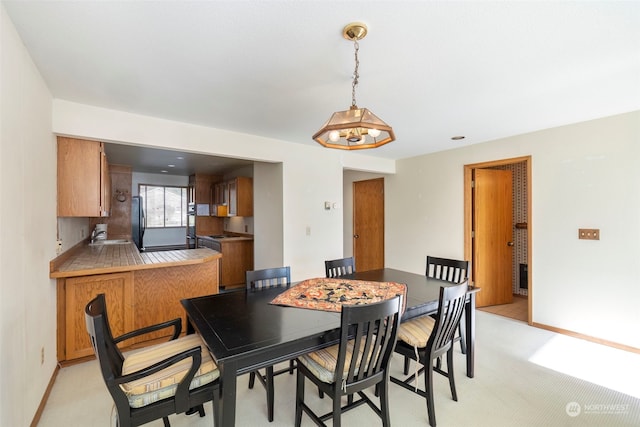 view of carpeted dining area