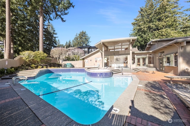 view of swimming pool with a patio