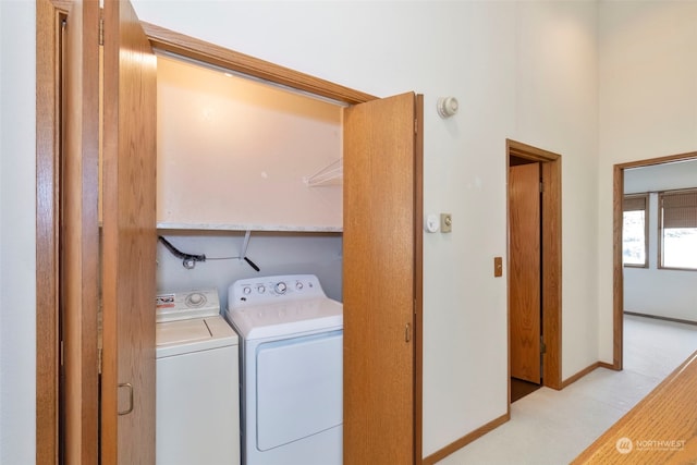 clothes washing area featuring washing machine and clothes dryer