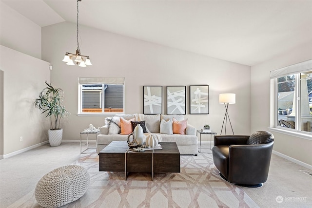 carpeted living room featuring lofted ceiling and an inviting chandelier