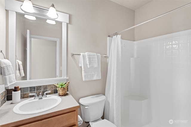 bathroom with vanity, toilet, and a shower with shower curtain